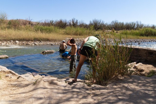 People soaking in spring water