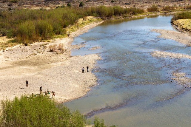 Birdseye view of Rio Grande River and people on the shore
