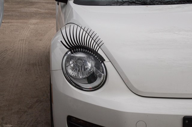 White Volkswagen Beetle with Eyelashes
