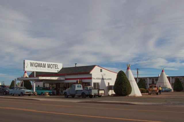 Wigwam Motel with tepees and antique cars