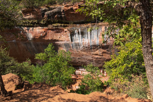 Waterfall stained rock cliff