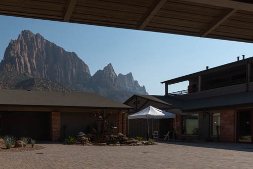 View of craggy cliffs behind a courtyard